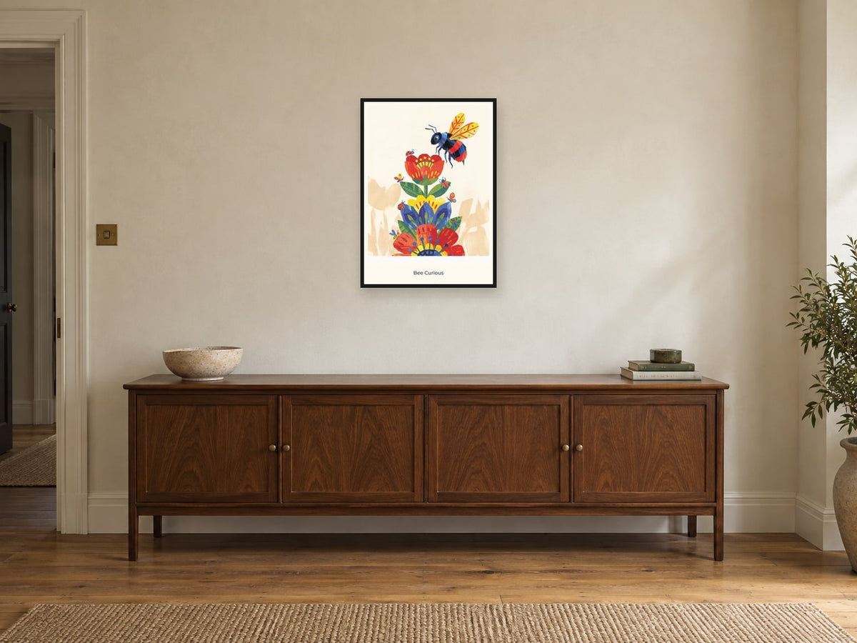 Bee Curious — Garden Party Children’s Art Print at A2, in a black frame, above a sideboard