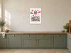 Blast Off — Playful Little Planet Children’s Art Print at A2, in a white frame, in a kitchen