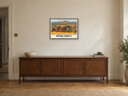 Brent Knoll (hill) Retro Railway Poster at A2, in a black frame, above a sideboard