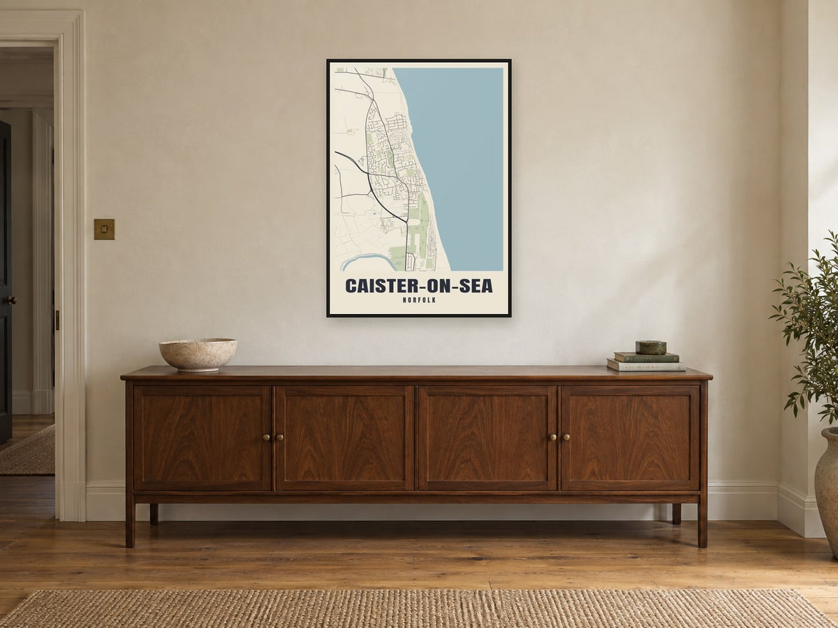 Caister-on-Sea Street Map Poster at A1, in a black frame, above a sideboard