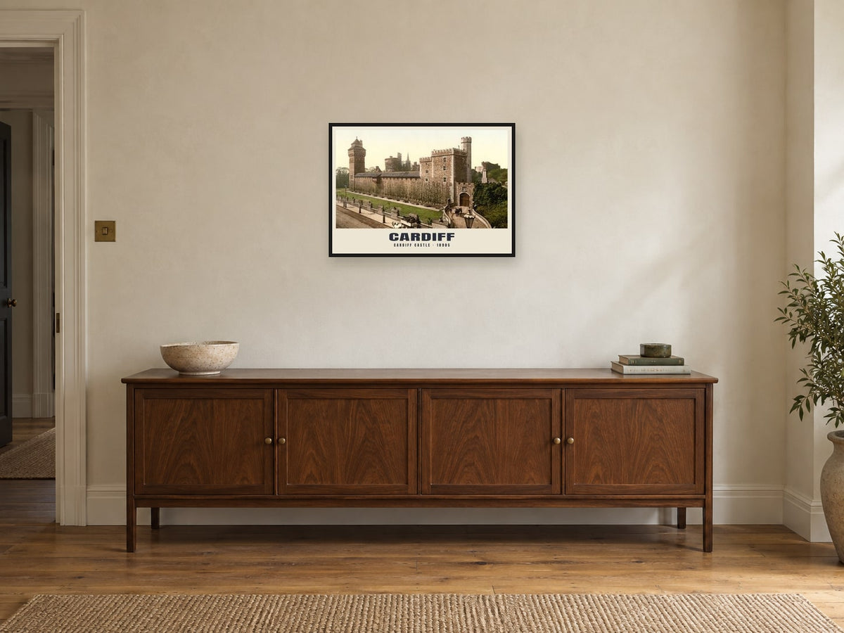 Cardiff Castle, 1890s Heritage Print at A2, in a black frame, above a sideboard
