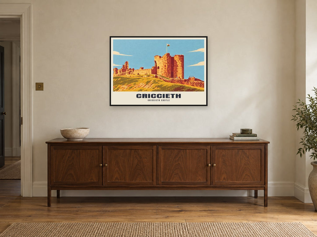 Criccieth Castle Poster at A1, in a black frame, above a sideboard