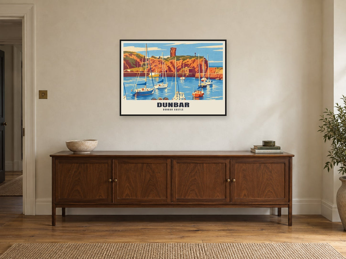 Dunbar Castle Poster at A1, in a black frame, above a sideboard