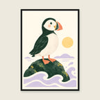 Puffin by the Sea children’s illustration in green, coral, lilac and yellow — styled with a black frame; choose the framed finish to include it