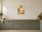 Crumbs Mean Company — A2 artwork shown in a room with a natural wood frame; select a framed finish to include a frame