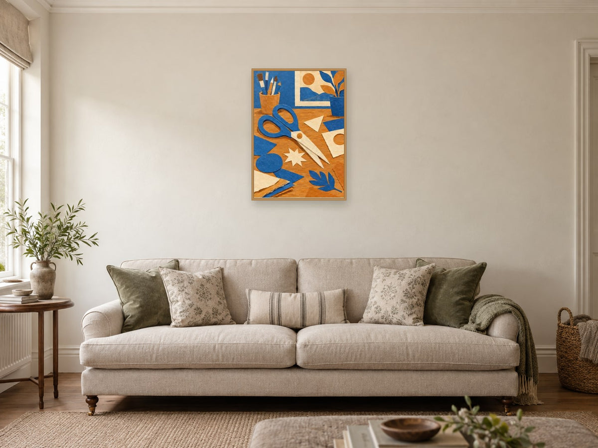 Oversized scissors and paper shapes across a workbench — A2 artwork shown in a room with a natural wood frame; select a framed finish to include a frame