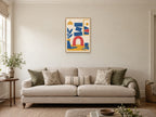 Offset cobalt blocks balancing on a coral arch — A2 artwork shown in a room with a natural wood frame; select a framed finish to include a frame