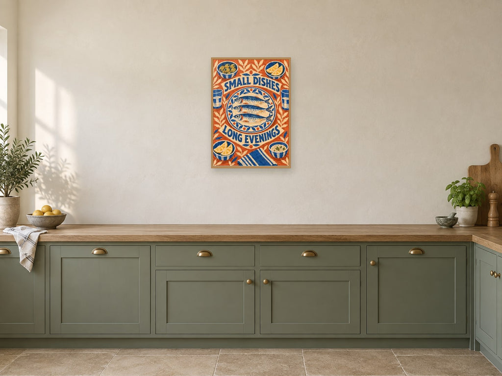 Small Dishes Long Evenings — A2 artwork shown in a room with a natural wood frame; select a framed finish to include a frame
